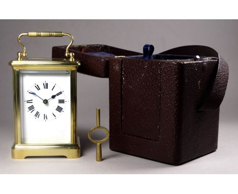 A 20th century carriage timepiece - with corniche case and white enamel dial set out with Roman numerals, height 12cm, with a