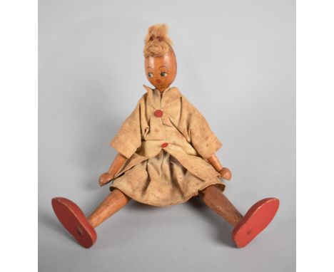 A Vintage Wooden Doll with Painted Face, 23cms High 