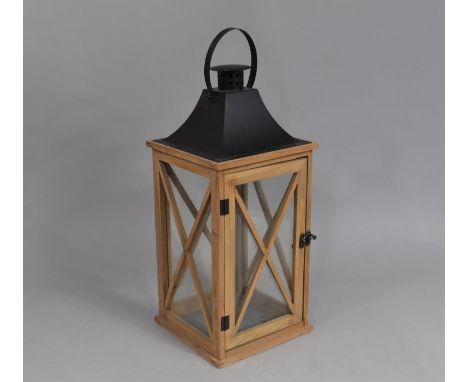 A Modern Metal Wooden Candle Lantern with Ring Carrying Handle, 51cms High 