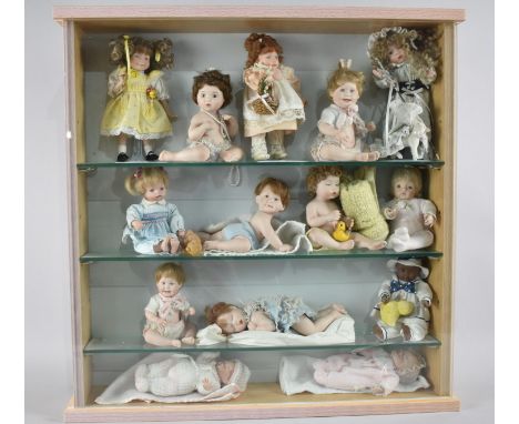 A Glazed Three Shelf Display Cabinet Containing Fourteen Ashton Drake Dolls, 55cm Square 