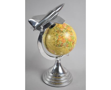 A Novelty Desk Top Globe with Chromed Stand and Vintage Jet Flying Over the World, 31cms High 