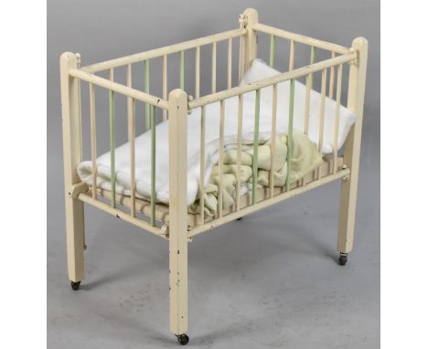A Vintage Wooden Dolls Cot, 62cm wide 