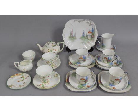 A Shelley Art Deco Tea Set decorated with Garden Scene having Foxgloves and Urn of Flowers comprising Four Cups, Jug, Cake Pl