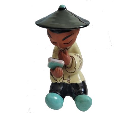 Mid-Century bookend "Reading Chinese" from Gretl Braun.Ceramic figure, painted with an oval mark to base "Made in Austria, in
