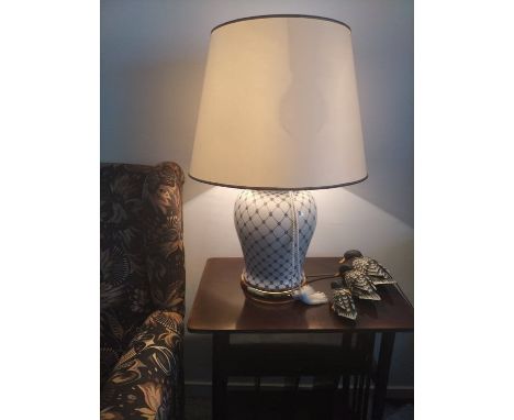 Modern Italina lamp,Bras/ colored base, Body handpainted, white ground with colbolt blue design. brass colored neck, double s