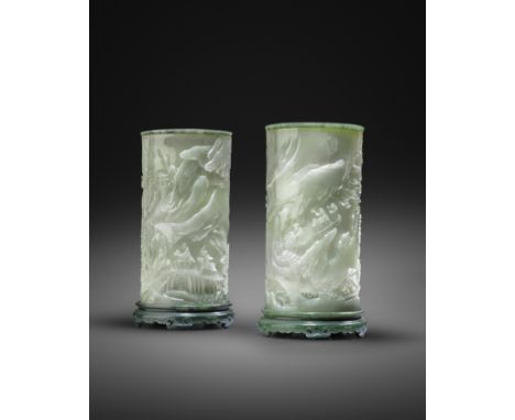 A PAIR OF FINE CHINESE PALE CELADON AND SPINACH-GREEN JADE 'LANDSCAPE' BRUSHPOTS, BITONG QIANLONG 1736-95  The tall cylindric
