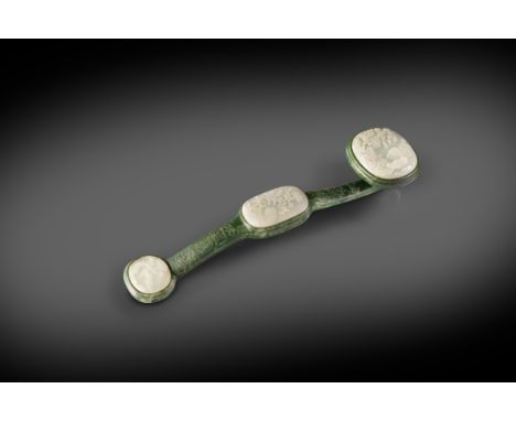 A CHINESE WHITE AND SPINACH-GREEN JADE RUYI SCEPTRE 18TH CENTURY  The mottled dark green sceptre inset with three oval white 