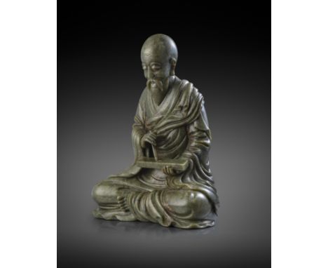 A RARE AND LARGE CHINESE SPINACH-GREEN JADE FIGURE OF A LUOHAN 18TH CENTURY  Depicted seated in dhyanasana holding a tablet i