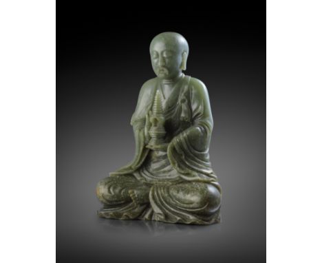 A RARE AND LARGE CHINESE SPINACH-GREEN JADE FIGURE OF A LUOHAN 18TH CENTURY  Carved seated in dhyanasana wearing a shawl and 