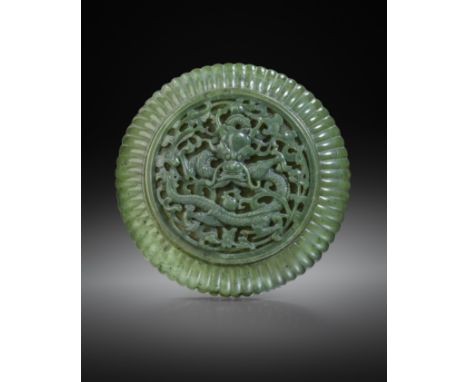 A RARE CHINESE IMPERIAL SPINACH-GREEN JADE CIRCULAR 'DRAGON' BOX AND COVER 18TH CENTURY  The domed cover decorated with a cen