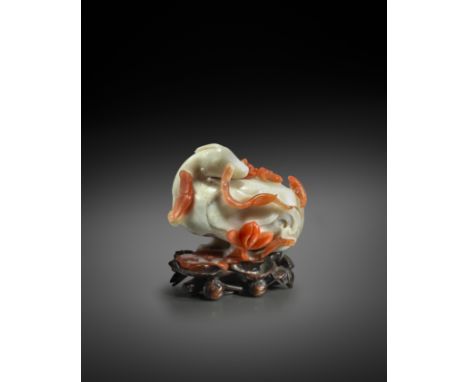 A FINE CHINESE CHALCEDONY 'MANDARIN DUCK' WATERPOT AND COVER 18TH CENTURY  Formed as a Mandarin duck standing upon a large lo