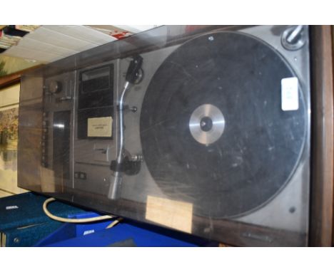 A vintage Sharp SG- 309H cassette and record player music centre. In good condition with dust cover.