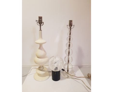 TWO TWENTIETH CENTURY LAMP BASES together with a plastic sphere lamp.
