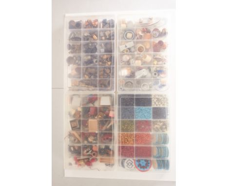 Four boxes of dolls house ornaments and crafting materialsComprising base metal goblets, kitchenalia, ceramic crockery and te