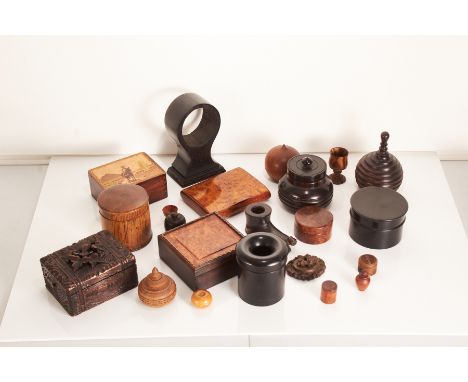 A collection of treen and other wooden itemsComprising an ebony hair tidy jar, three lidded pots, an ebonised balloon shaped 