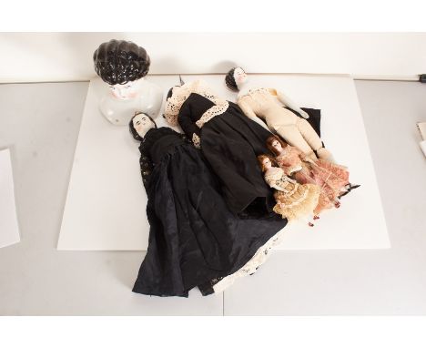 Three late 19th / early 20th century German ceramic headed dolls, circa 1900Cloth bodies with ceramic heads, feet and hands, 