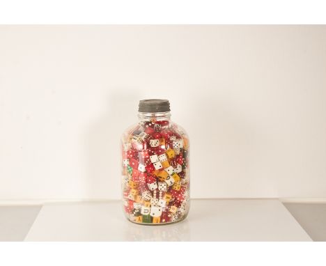 A novelty table ornament, a glass jar full of numerous diceVarious examples and colours including wood and plastic.Height – 2