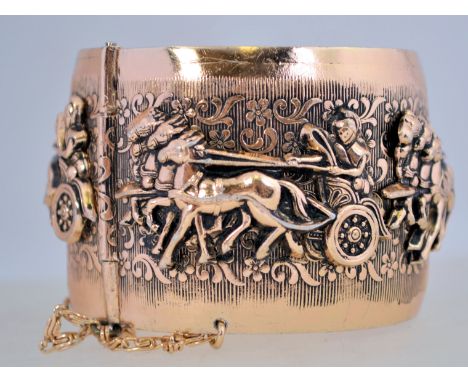 A large 1960's ' Ben Hur ' hinged bangle in rose gold tone metal with a pin clasp. Inner diameter 6.5cms
