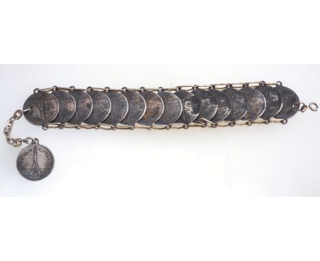 A vintage Paris souvenir bracelet with antiqued silvertone metal and a bolt ring clasp, measuring 23cms long.