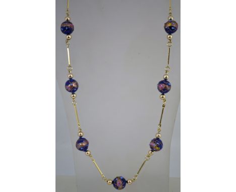 A vintage Venetian wedding cake bead necklace with a  gold tone metal chain, overall it measures 75cms long.