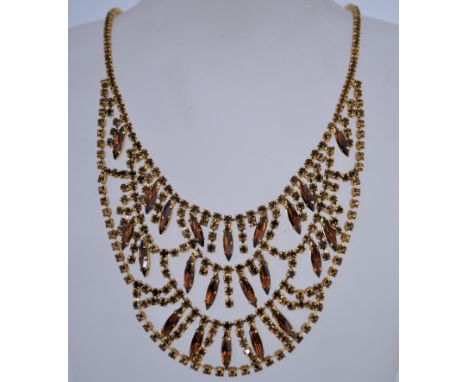 A very large vintage 1960s to 1970s rhinestone showgirl necklace measuring 43cms long, with topaz and smoky quartz colour rhi