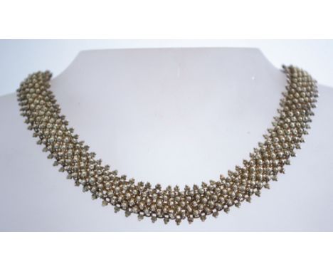 A vintage silver canetille work mesh necklace with a bolt ring clasp. It is unmarked but tests as sterling and weighs 37 gram