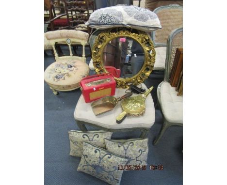 A circular gilt framed wall mirror, a Roberts radio, a brass clad fire bellow, cushions and other items 