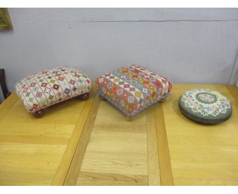 Three modern foot stools each with a tapestry upholstered top 