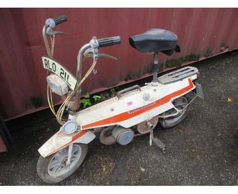 A 1970s Motobecane folding moped with case, registration number RL0 21L 