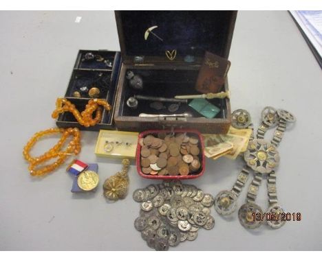 An early 20th century leather cased jewellery box and contents to include a small quantity of silver items, a carved ivory se