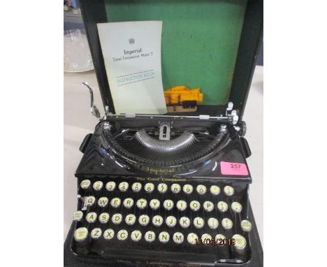 A vintage Imperial black painted typewriter with instructions and case 
