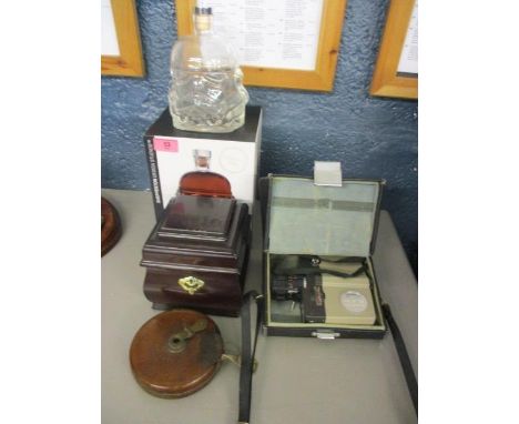 A mixed lot to include a vintage tape measure, a Sankyo 8mm camera and other items 