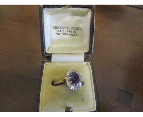 An 18ct gold amethyst and diamond ring 