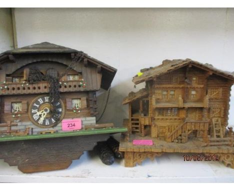 A mid 20th century cuckoo clock and a treen box in the form of an Austrian chalet 