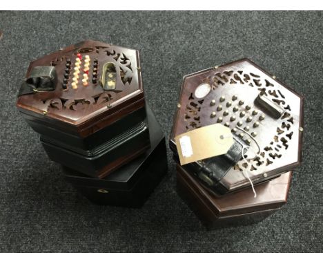 A Lachenal & Co 24 button concertina, with rosewood fretwork ends (for restoration), in original box, together with another s