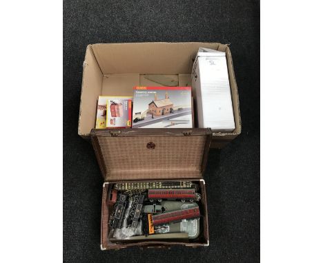 A box of vintage leather case containing rolling stock, assorted Hornby boxed accessories and track