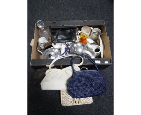 A box of bed pans, glass decanter with stopper, Everhot teapot, commemorative china together with six vintage hand bags (one 