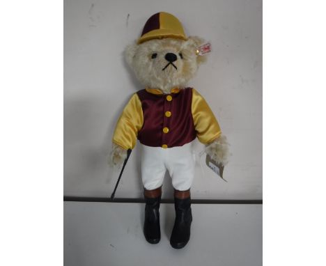 A Steiff golden mohair bear - The jockey, length 36 cm.