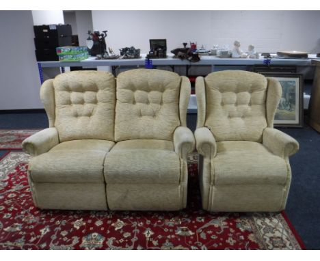Two seater settee and armchair in a gold button fabric 