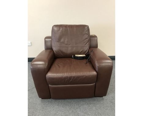 A brown button leather electric reclining armchair 
