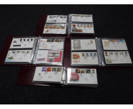 Four albums of first day covers