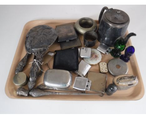 A tray of plated wares, silver cigarette case, mirror and brush back, assorted lighters, compacts, two antique eye baths etc 