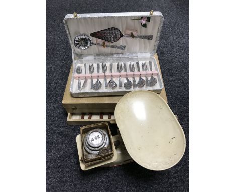 A set of vintage Harper enamel scales with weights together with a boxed china teaset, cased stainless steel cake set and set