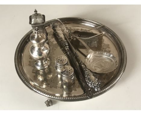 A silver plated card tray together with a collection of silver items including salt and pepper pots, caddy spoon etc.