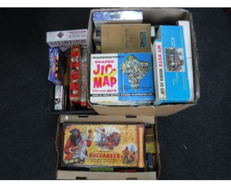 Three boxes of vintage board games including Waddingston Buccaneer, Escape from Colditz, jigsaws, table tennis bats etc 