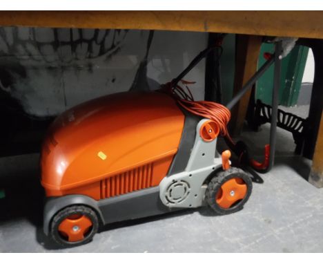A Flymo lawn rake compact 3400 