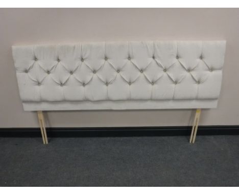 A 6' headboard upholstered in a button fabric 