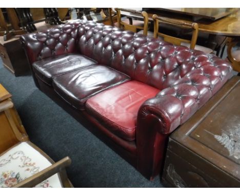 A red button leather Chesterfield three seater settee 
