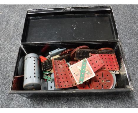 A metal box containing a quantity of vintage Meccano 