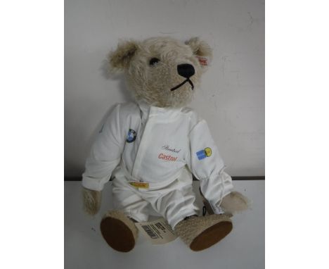 A Steiff light mohair bear - BMW bear, length 32 cm.